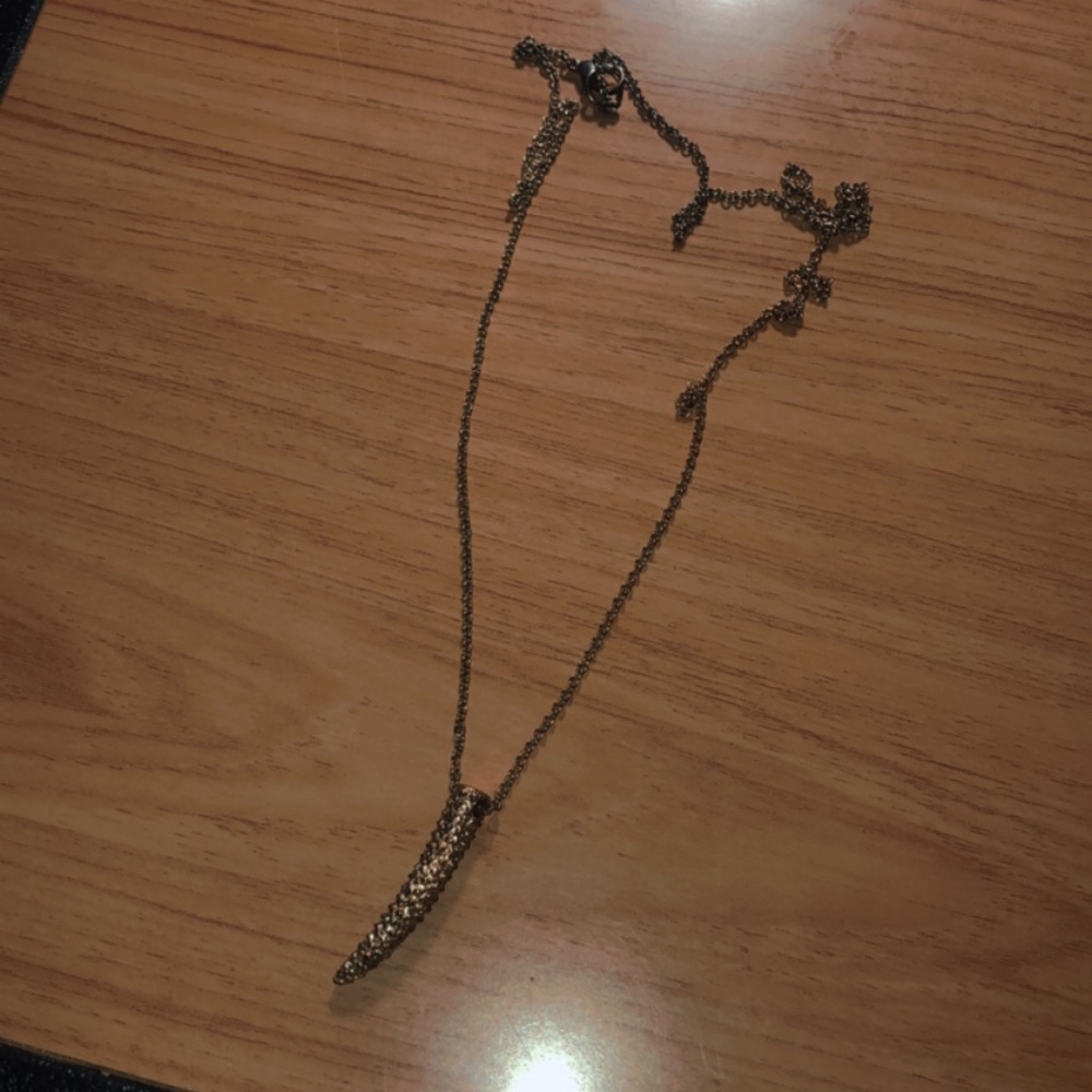 Golden elephant tusk necklace
